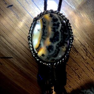 Gorgeous natural dendritic agate bolo on la leather twisted tie.